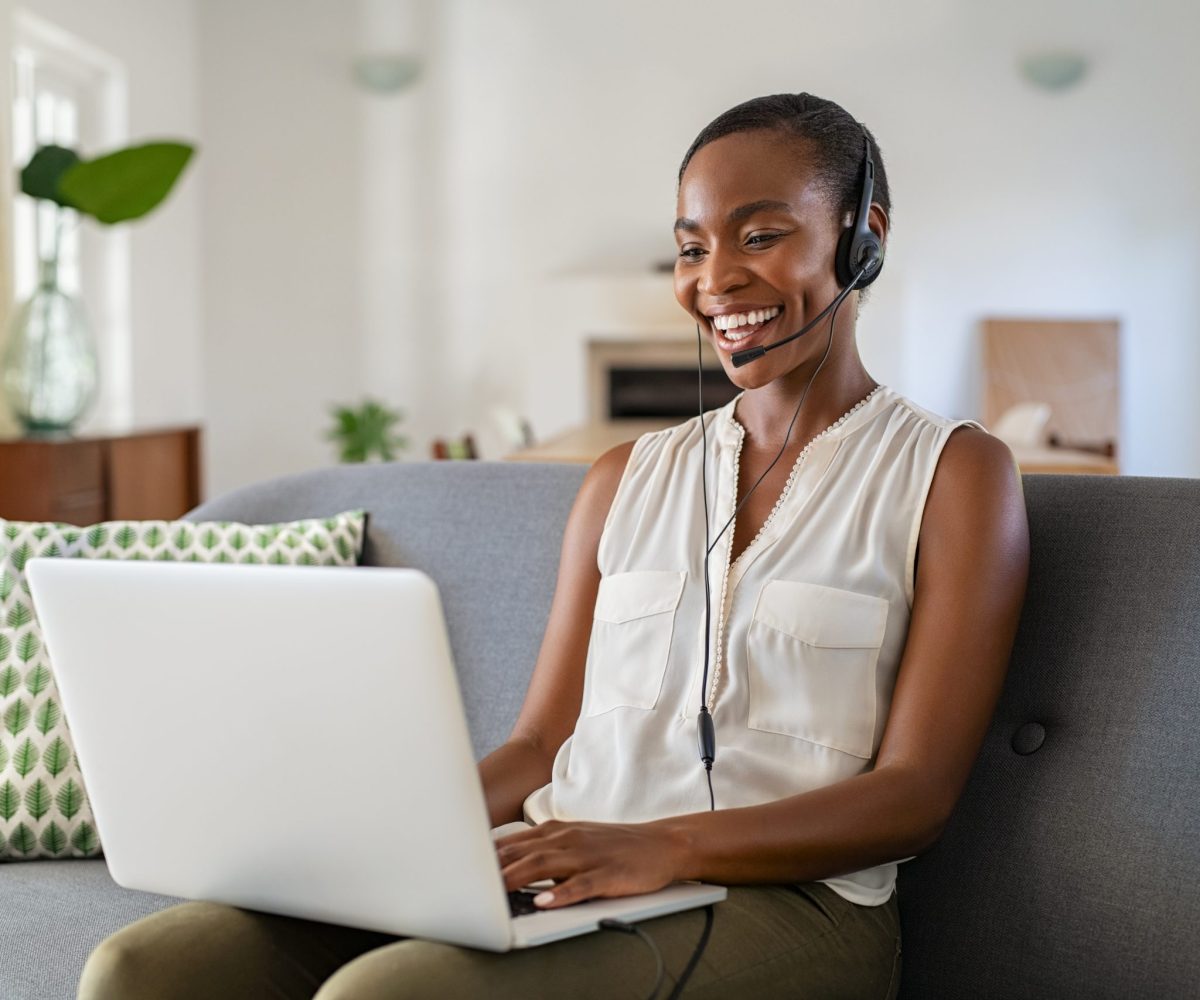 Successful,Middle,Aged,African,Woman,With,Headphone,And,Mic,Talking